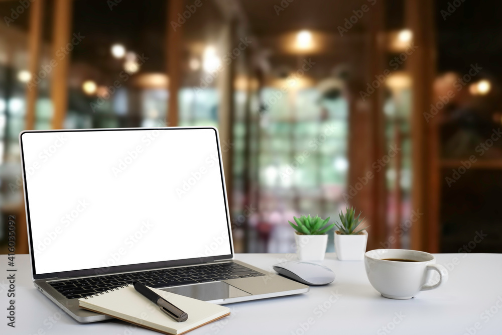 Laptop computer notebook open with blank monitor white screen display on work table desk. Workspace office modern for job business online communication technology in shop or home indoor. Laptop computer notebook open with blank monitor white screen display on work table desk. Workspace office modern for job business online communication technology in shop or home indoor.