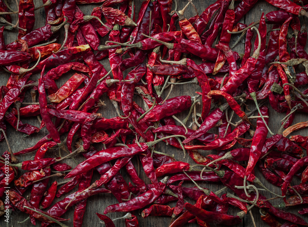 Dried red chilies on Brown wood background