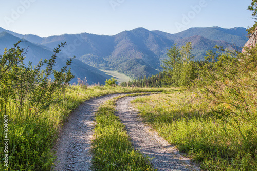 Mountain country road in summer morning