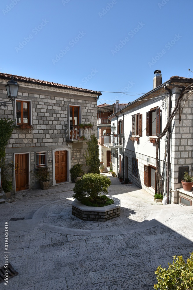 Obraz premium A street among the old stone houses of Rocca San Felice, a medieval village in the province of Avellino.