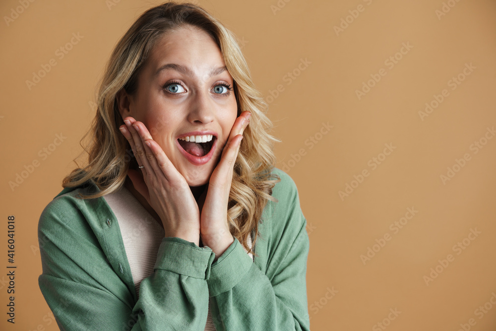Excited blonde woman expressing surprise at camera Excited blonde woman expressing surprise at camera