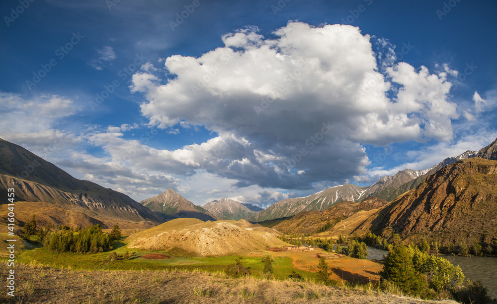 Valley in the Altai mountains on a summer day, picturesque sky with clouds