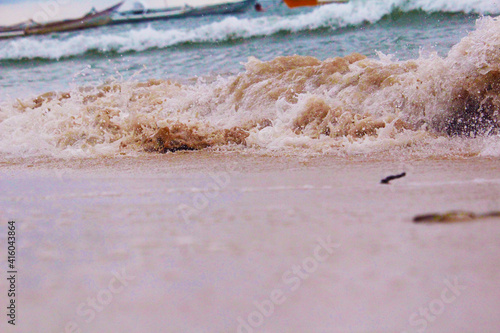 JENEPONTO INDONESIA february 21, 2021: Breaking waves on the shore of Dase Punagaya photo