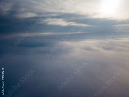 Flight high above the clouds. Aerial drone view. © Sergey