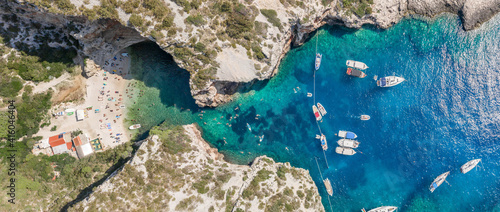 Fototapeta Naklejka Na Ścianę i Meble -  Aerial panoramic overhead drone shot of yachts at adriatic sea tourists at Stiniva beach on Vis Island in Croatia summer