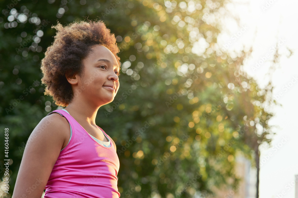 Cute Afro American girl standing on the street Cute Afro American girl standing on the street