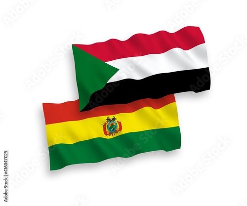 National vector fabric wave flags of Bolivia and Sudan isolated on white background. 1 to 2 proportion.