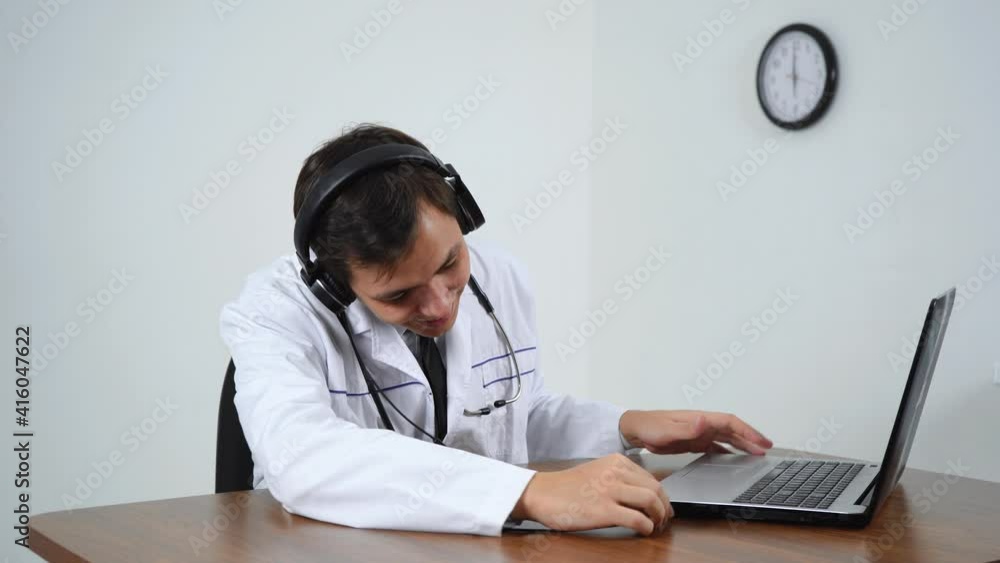 male doctor speaks with a patient on a laptop male doctor speaks with a patient on a laptop