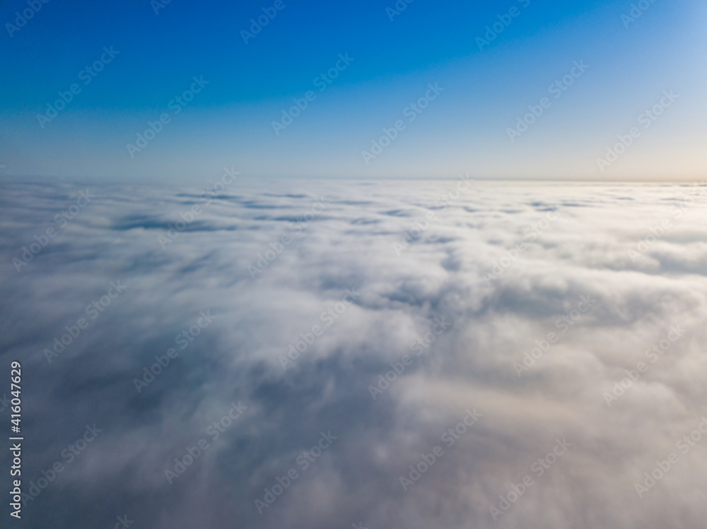 Flight high above the clouds. Aerial drone view. Flight high above the clouds. Aerial drone view.