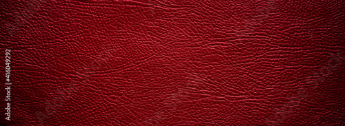 Texture of red eco-leather for production, rectangular shape in the form of a banner