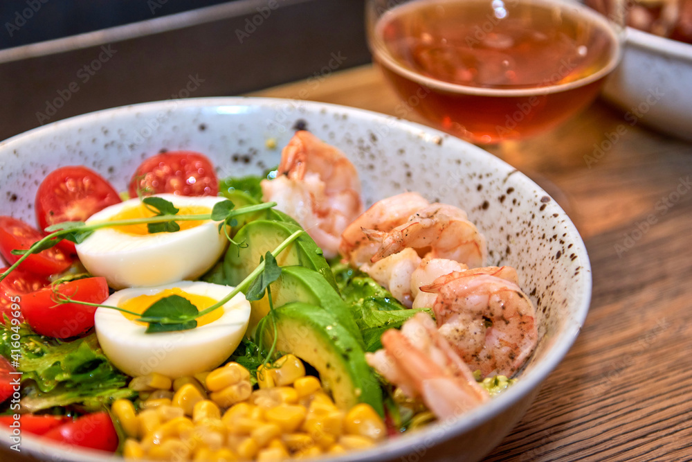 Delicious shrimp in restaurant on a wooden table, no people are visible. Tasty seafood with beer in cafe or pub menu. Delicious shrimp in restaurant on a wooden table, no people are visible. Tasty seafood with beer in cafe or pub menu.
