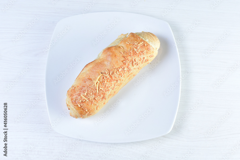 Freshly baked bakery displayed on white wooden background Freshly baked bakery displayed on white wooden background