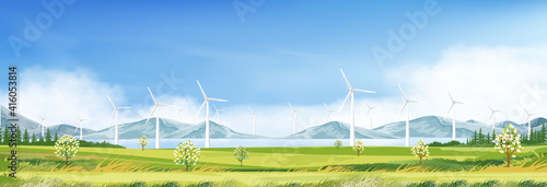 Windmill for electric power productions on green grass fields,Spring morning sky,cloud with alternative energy creation with wind power in farmland,Landscape with turbine energy on sunny day Summer