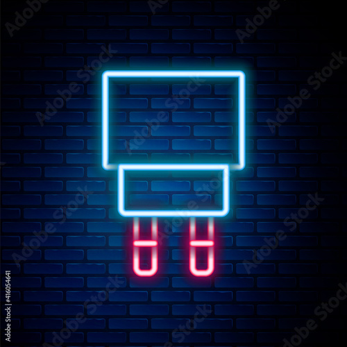 Glowing neon line Charger icon isolated on brick wall background. Colorful outline concept. Vector.