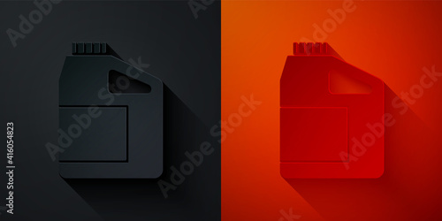 Paper cut Canister for motor machine oil icon isolated on black and red background. Oil gallon. Oil change service and repair. Engine oil sign. Paper art style. Vector.