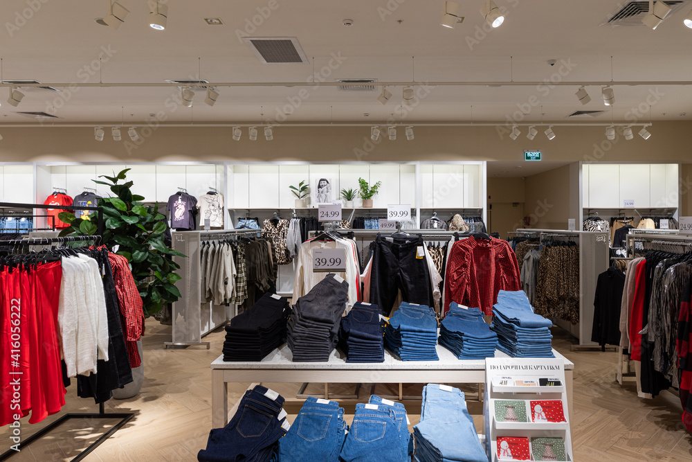 Modern fashionable brand interior of men and women clothing shop store inside shopping center
