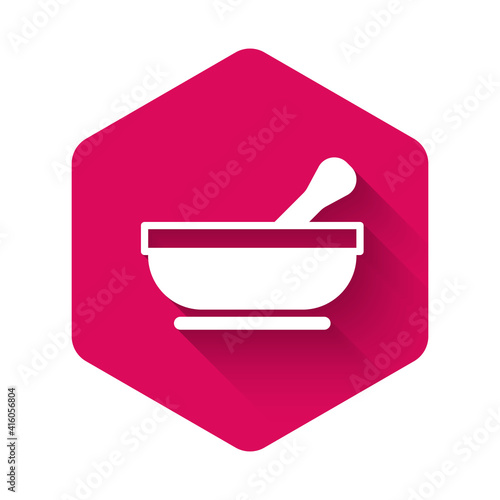 White Mortar and pestle icon isolated with long shadow background. Pink hexagon button. Vector.