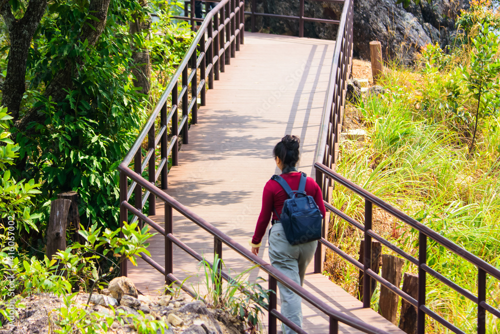 Tourists walking on the nature trail at Chae Son National Park Lampang Thailand. Tourists walking on the nature trail at Chae Son National Park Lampang Thailand.