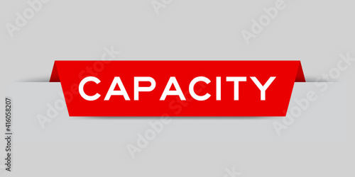 Red color inserted label with word capacity on gray background