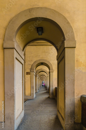 Great view of the arched passageway below the famous Vasari Corridor in Florence along the Arno river connecting the bridge Ponte Vecchio with the Uffizi museum.