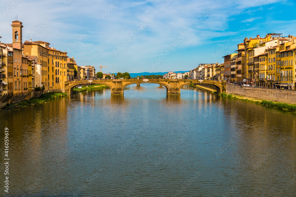 Beautiful panoramic view of the bridge Ponte Santa Trìnita spanning the Arno river in the historic city centre of Florence. The Renaissance bridge is the oldest elliptic arch bridge in the world.