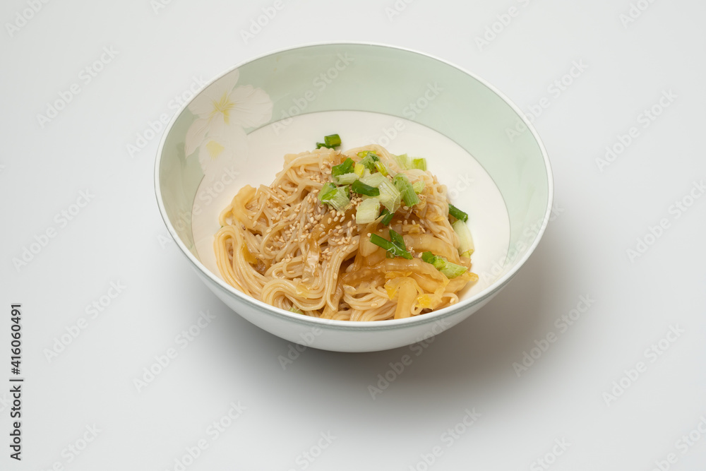 a close-up of soy sauce noodle a close-up of soy sauce noodle