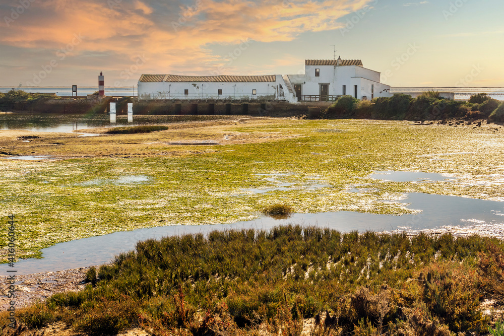 Tide mill building in Ria Formosa Natural Park, Olhao, Algarve, Portugal