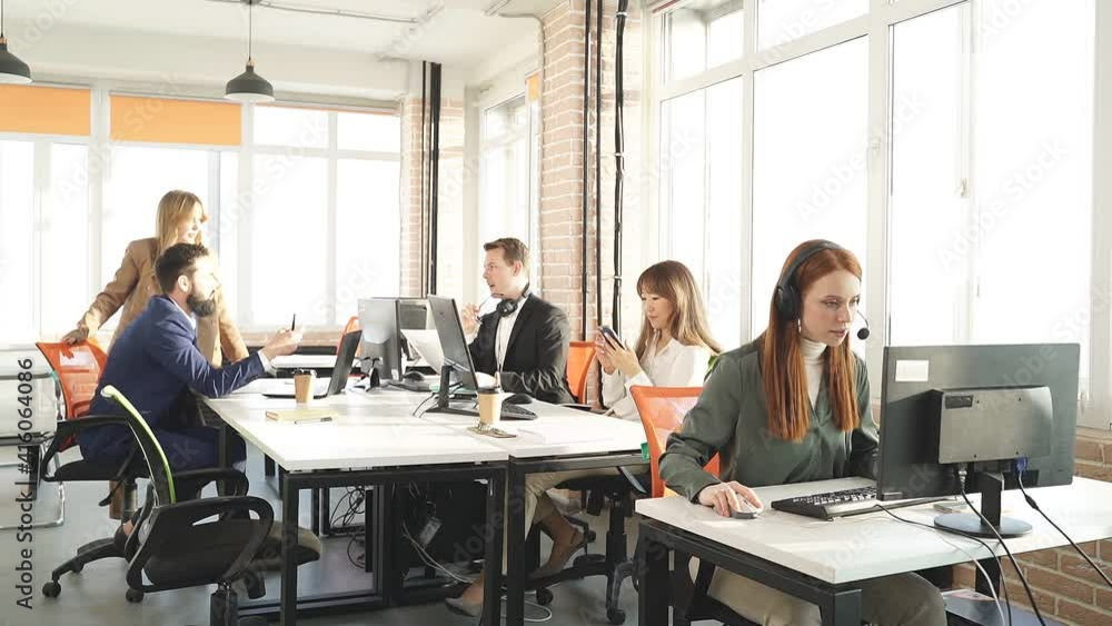 Typical working day. business people sitting in modern office and using computer, wearing formal outfits, they are coworking, solve all matters, be in time for the deadline. Typical working day. business people sitting in modern office and using computer, wearing formal outfits, they are coworking, solve all matters, be in time for the deadline.