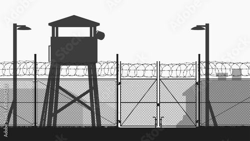 chain fence and guard tower at military base