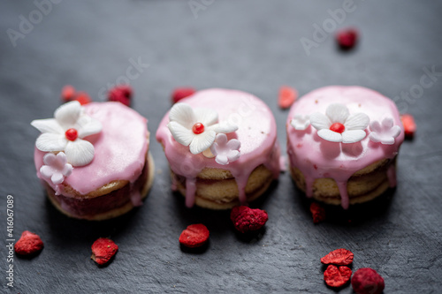 Fototapeta Naklejka Na Ścianę i Meble -  selection of cute pink love sponge cakes  for mothersday valentines day wedding with freezedried berries