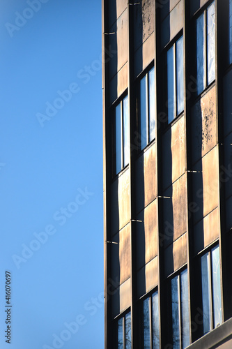 windows of a tall building from a low perspective