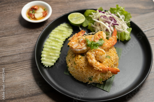 Prawn Fried Rice with folk and spoon on marble background ready to eat