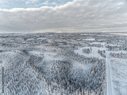 Drone shot of Swedish forest and road in winter photo