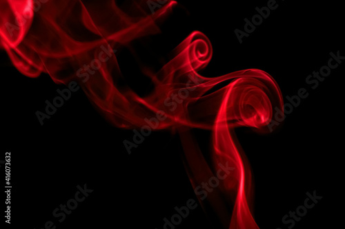 swirling movement of red smoke group, abstract line Isolated on black background