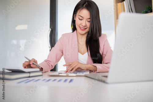 Portrait Of Businesswoman Working On Laptop ,success happy pose. internet technology,work from home,business financial and reporting concept.