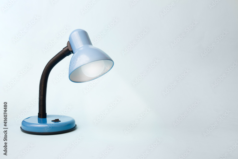 Creative concept of the idea. Learning and finding inspiration. Blue lamp on a blue pastel background Creative concept of the idea. Learning and finding inspiration. Blue lamp on a blue pastel background