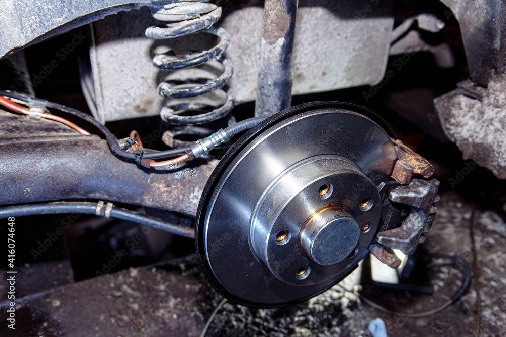 New car brake disc, brake system repair concept in garage