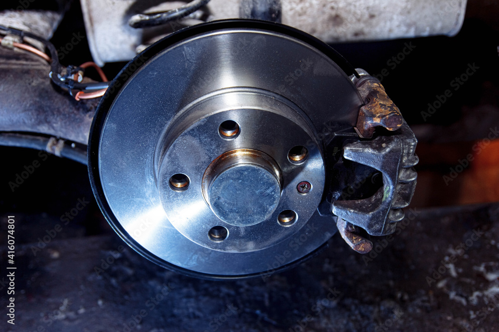 New car brake disc, brake system repair concept in garage New car brake disc, brake system repair concept in garage
