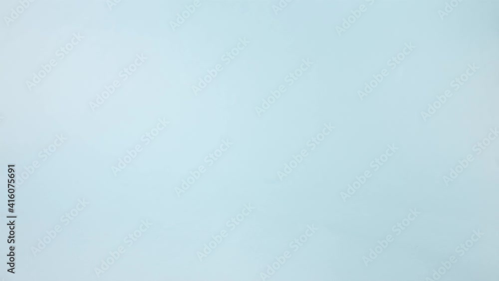Shopping trolley with Easter eggs on blue background. Easter shopping and sale concept. Stop motion Shopping trolley with Easter eggs on blue background. Easter shopping and sale concept. Stop motion