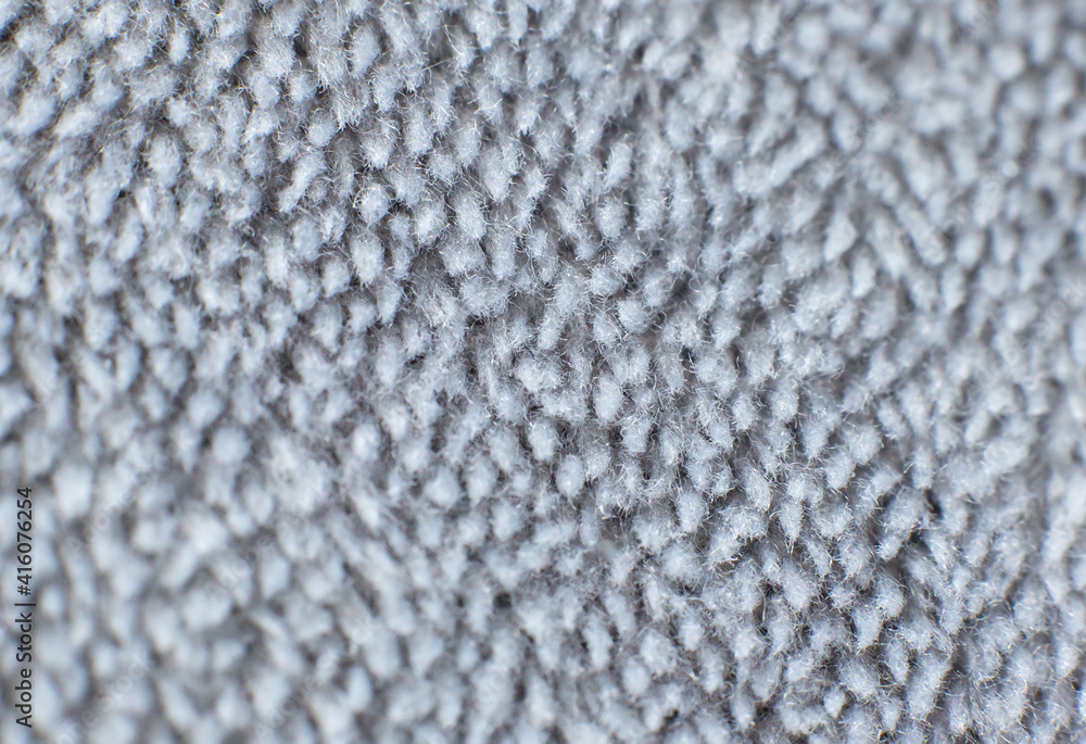 Grey cotton towel or carpet.fluffy texture background. Close up photo. Grey cotton towel or carpet.fluffy texture background. Close up photo.