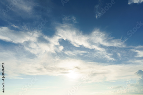 blue sky background. Summer sky is bright blue. There are clouds floating through. Feel relax when looking. See the sun on the sun.