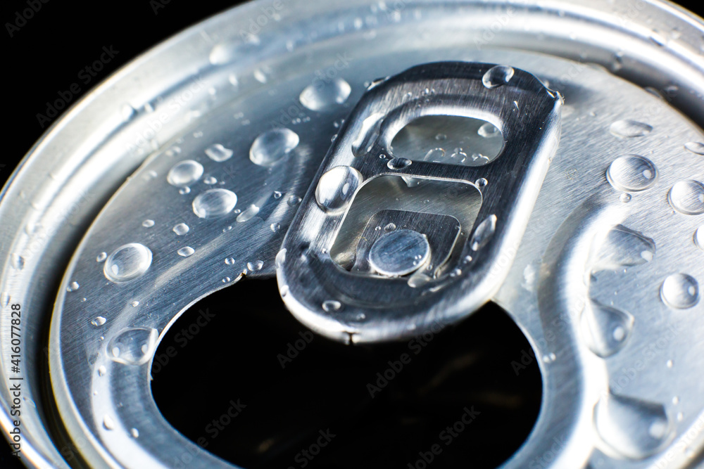 Can of fizzy drink with drops on black background. Refreshing during summer heat. Vacations mood. Can of fizzy drink with drops on black background. Refreshing during summer heat. Vacations mood.