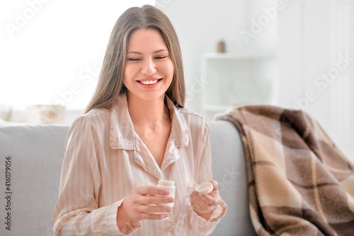 Beautiful young woman takin...