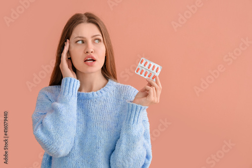 Thoughtful young woman with...
