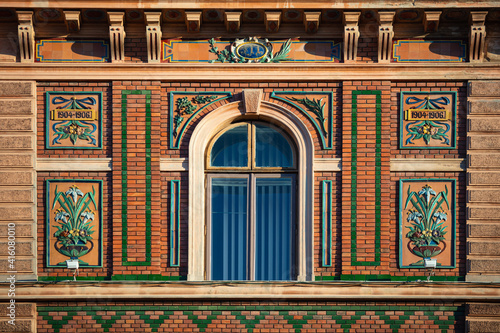 CHERNIVTSI, UKRAINE - JULY 16, 2017:  Ancient window on building in Chernivtsi, Ukraine