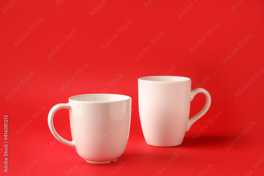 Empty cups on color background Empty cups on color background