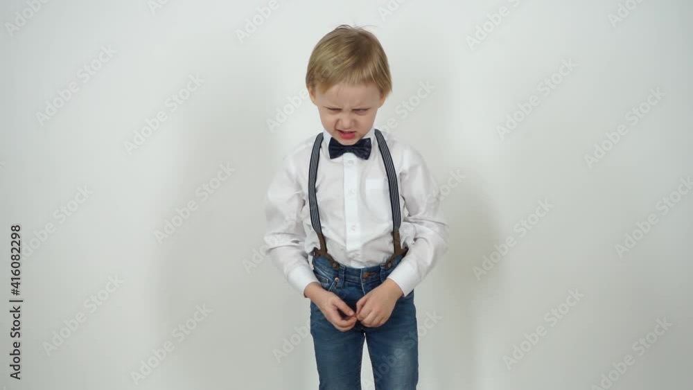 little boy shows anger. Dressed in jeans and a shirt on a white background. Emotion Video Series little boy shows anger. Dressed in jeans and a shirt on a white background. Emotion Video Series