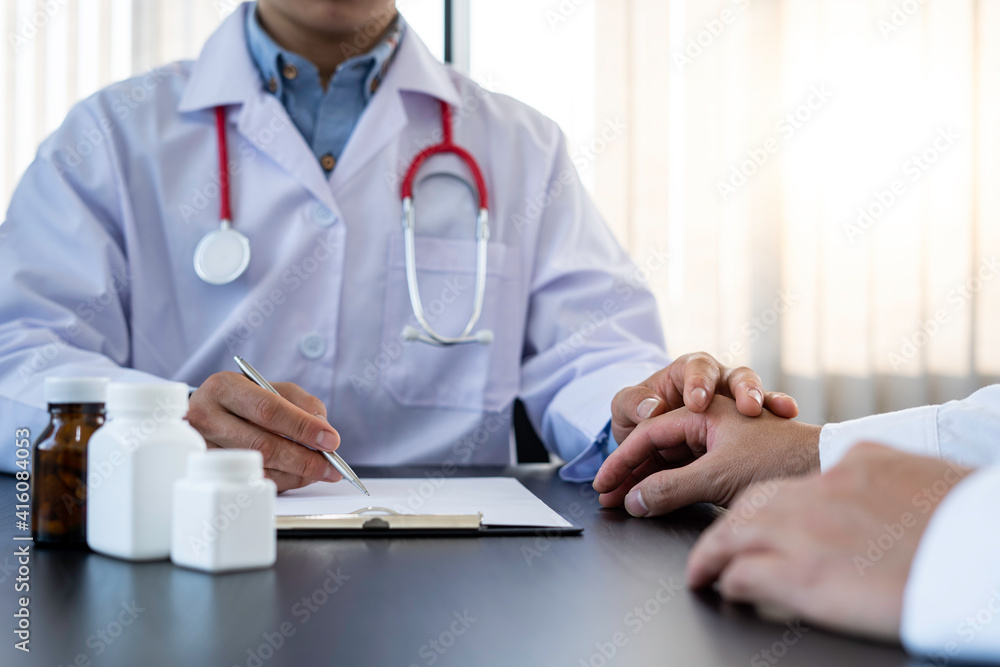 The doctor or pharmacist is discussing and encouraging the results of the treatment. With the patients who were examined, counseling ideas and treatment guidelines The doctor or pharmacist is discussing and encouraging the results of the treatment. With the patients who were examined, counseling ideas and treatment guidelines