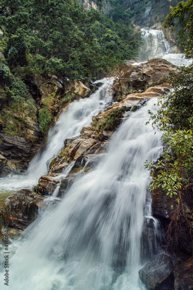 Fototapeta premium The stream of water between the rocks in the mountains Sri Lanka. Long exposure.