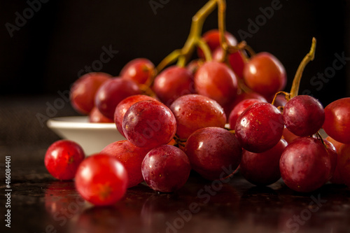 Closeup on grapes on black background